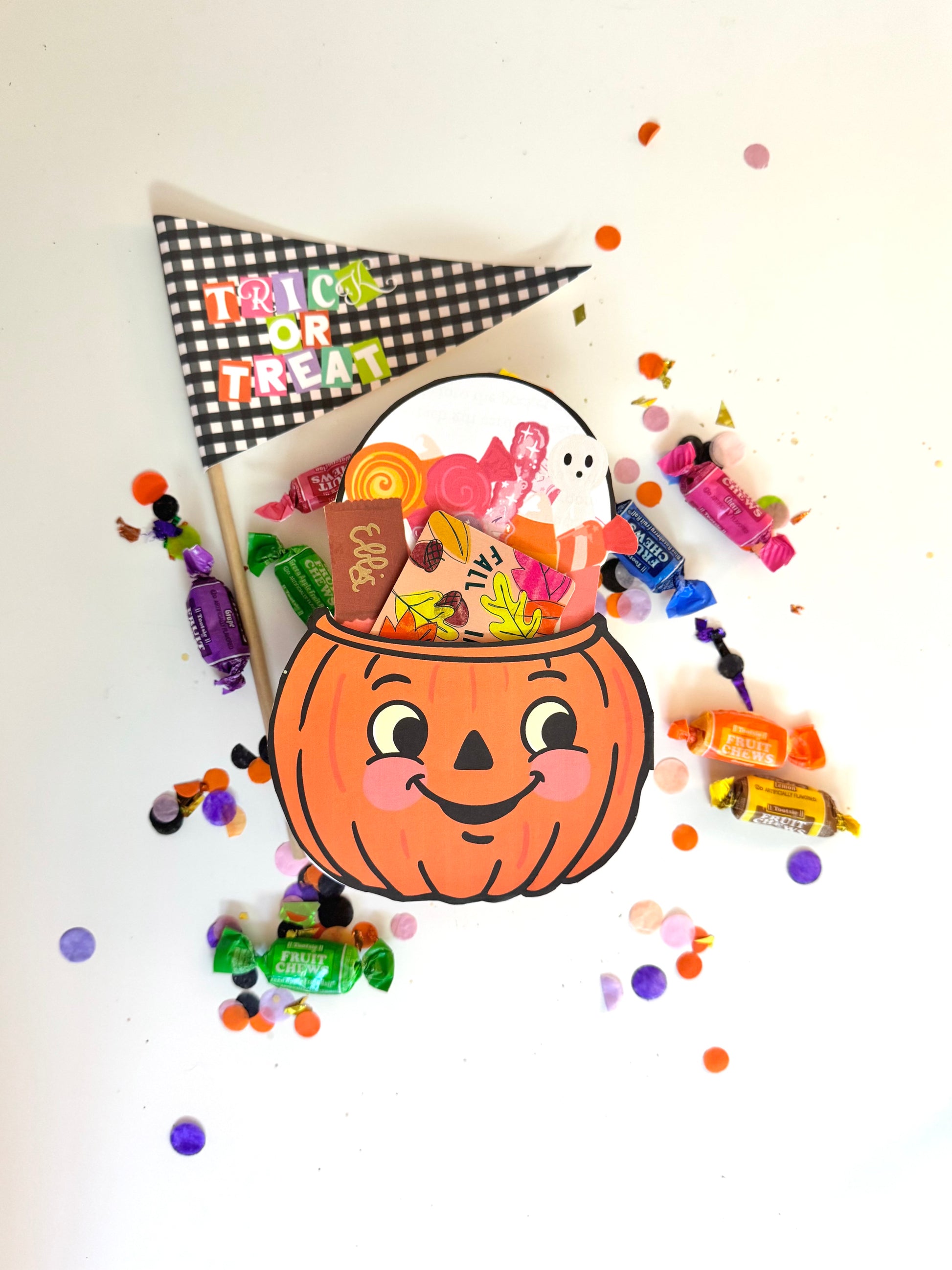 Halloween-themed candy holder with a pumpkin design